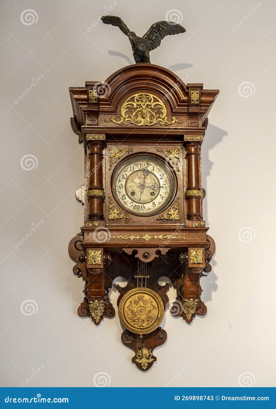 Wooden Wall Clock with a Pendulum of the 19th Century Stock Image