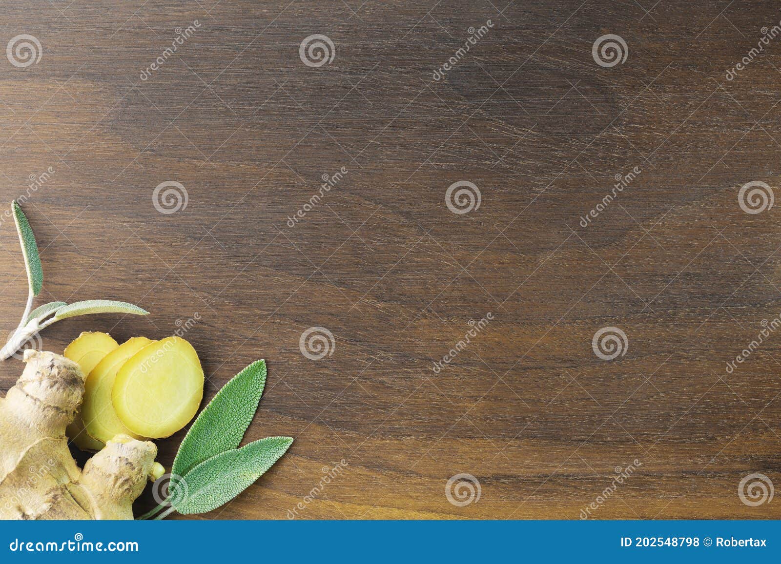 wooden walnut cutting board with ginger and sage