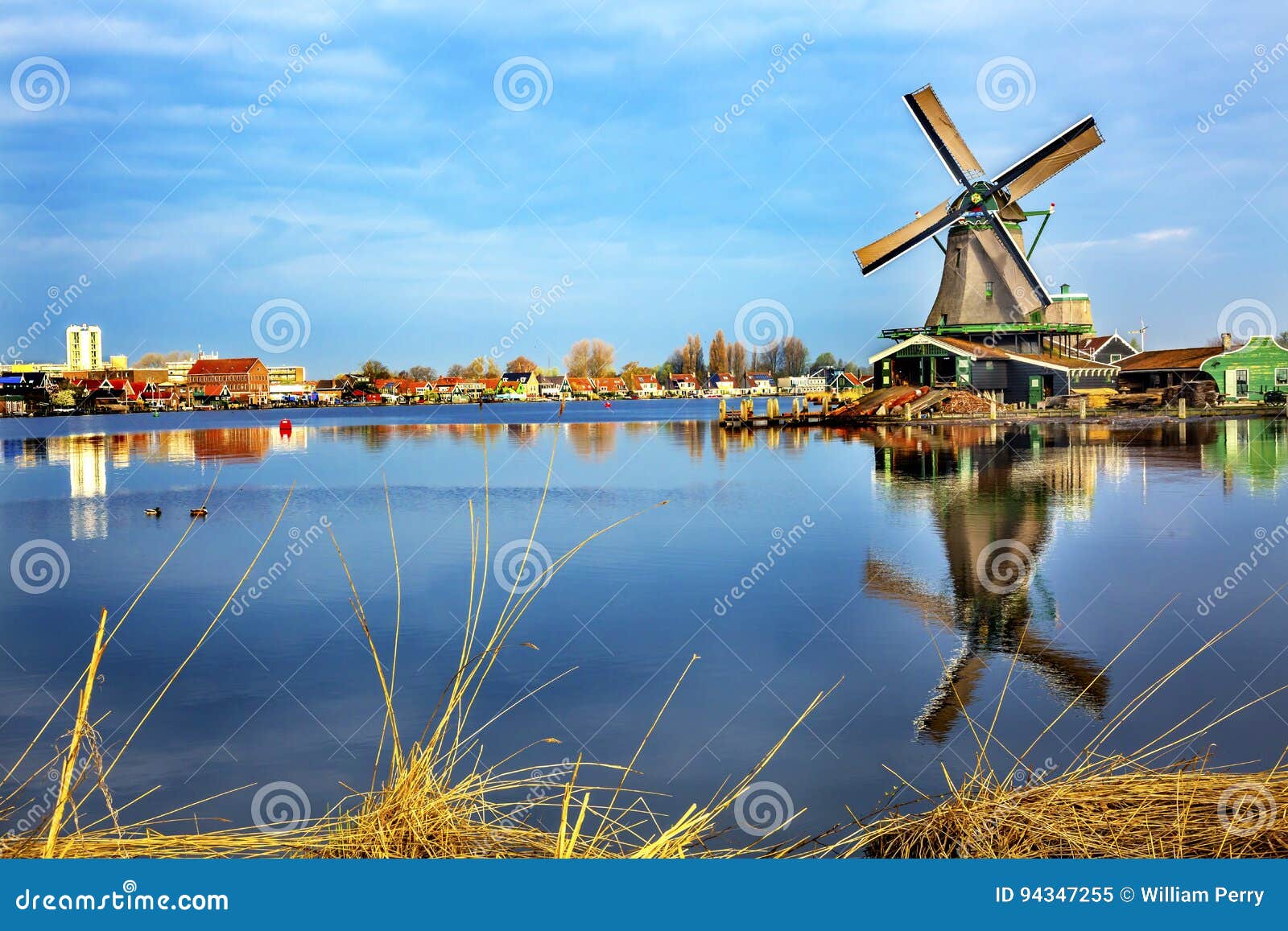 wooden windmill river zaan zaanse schans vholland netherlands