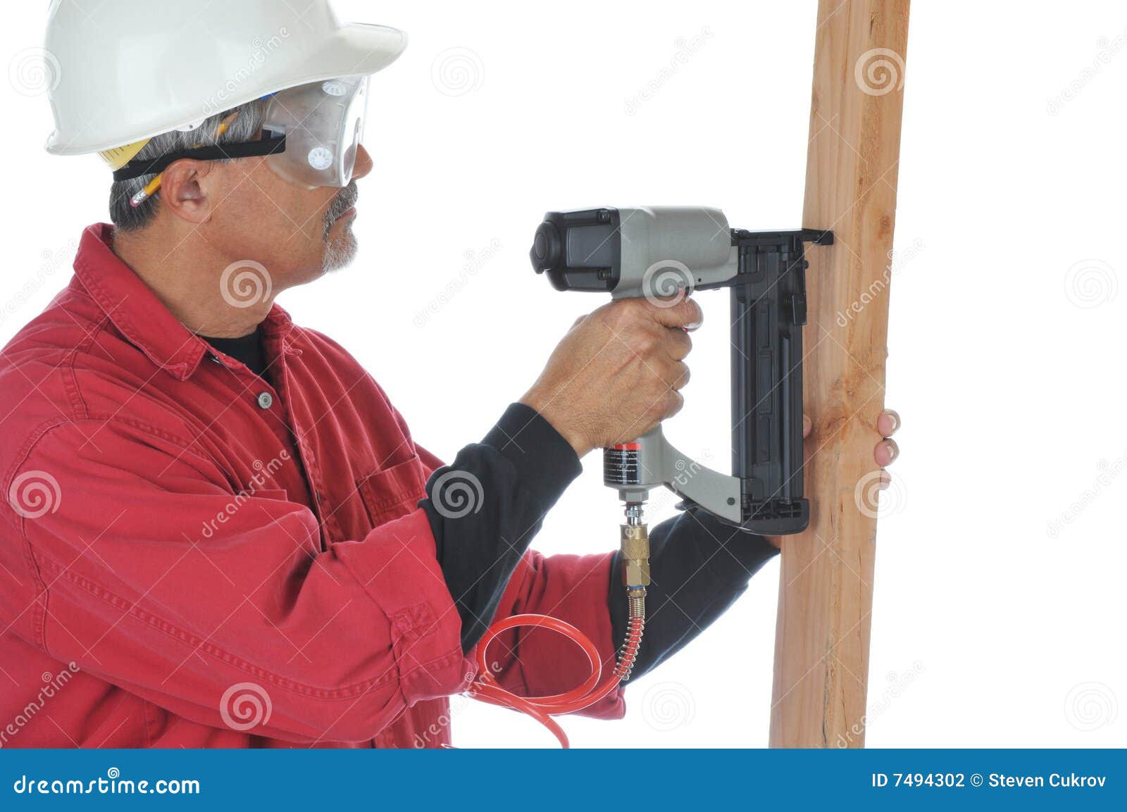 Woodworker Using Nail Gun stock photo. Image of woodworker 7494302