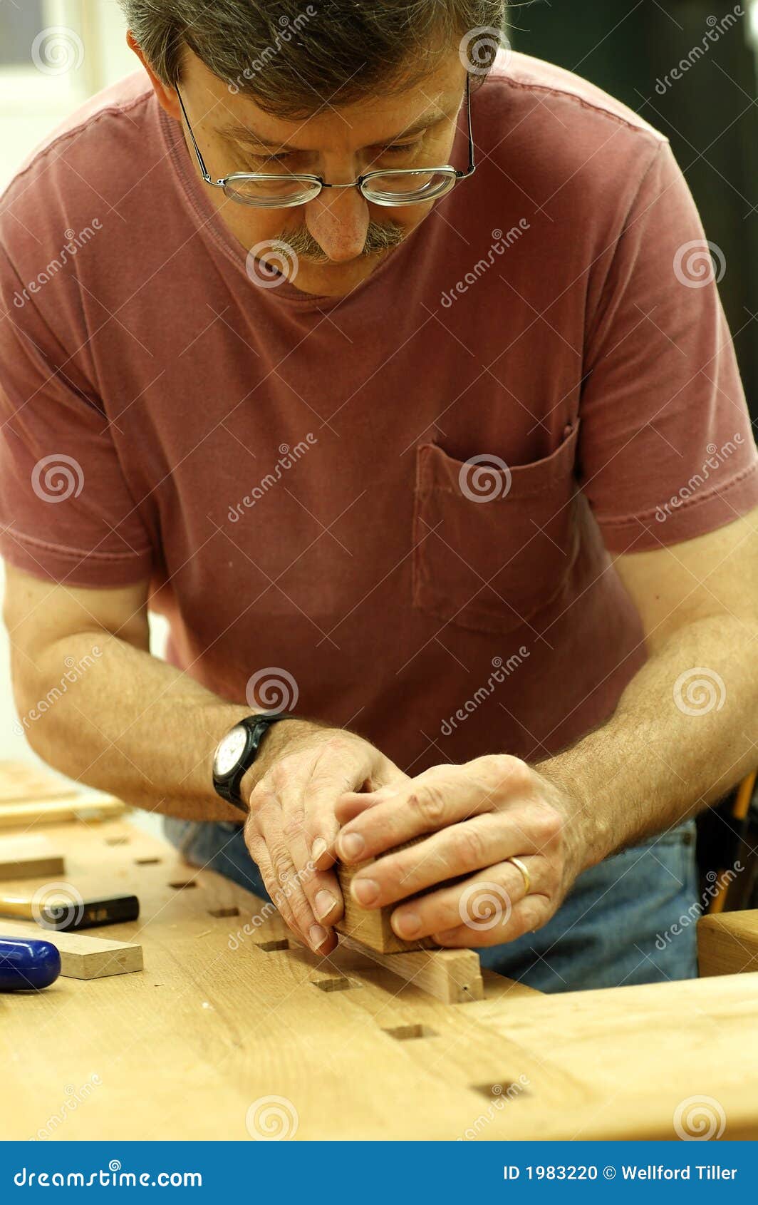woodworker using a plane