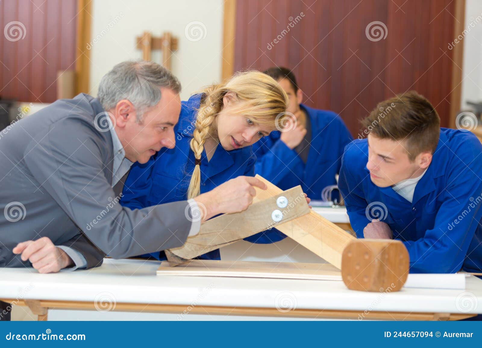 Woodworking Apprentice Observing Making Practical Furniture Stock Photo