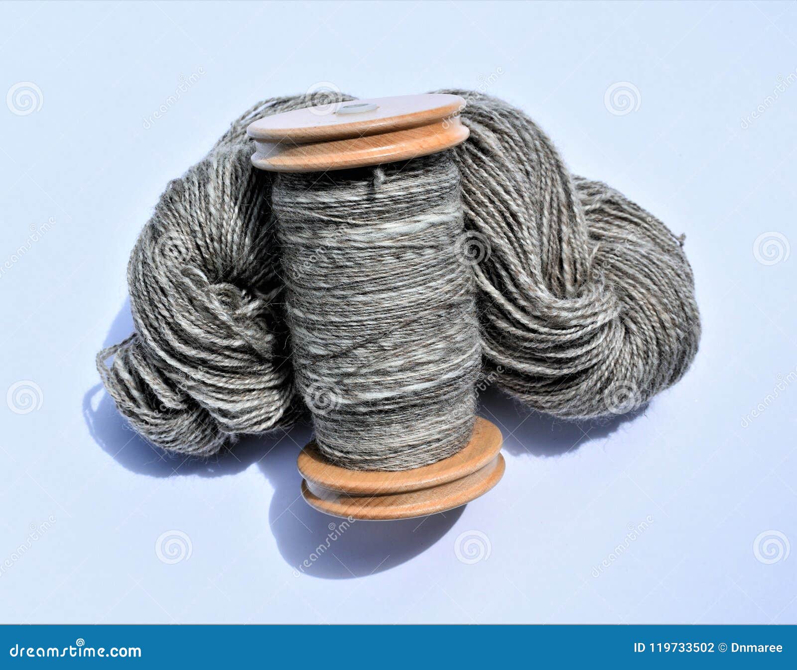 Blue thread. Set of sewing thread coils on white natural fabric