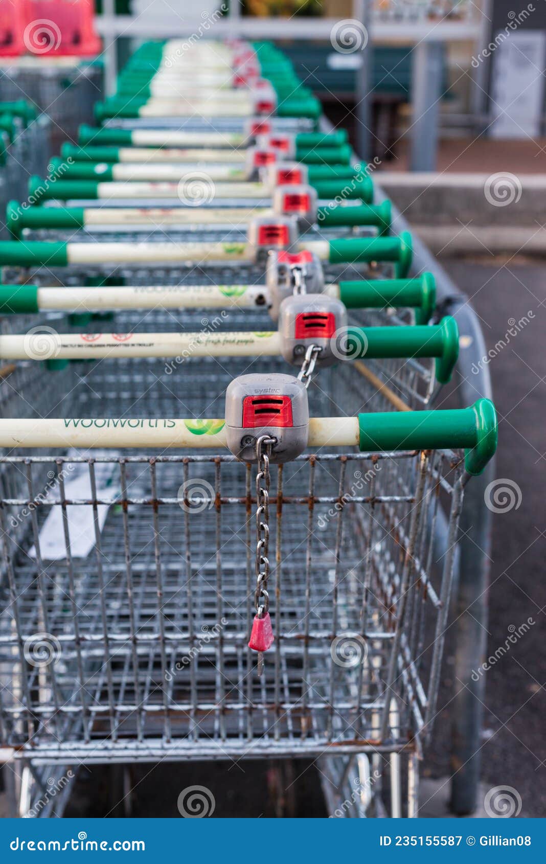 Row of Woolworths Trolley Coin Operated Locking Device Editorial