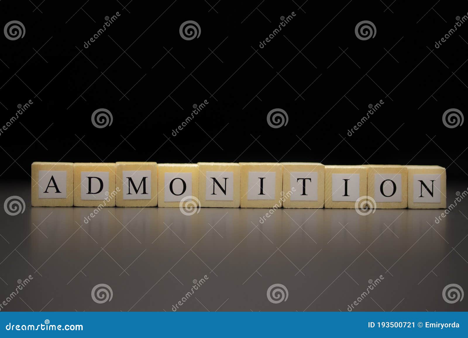 the word admonition written on wooden cubes  on a black background
