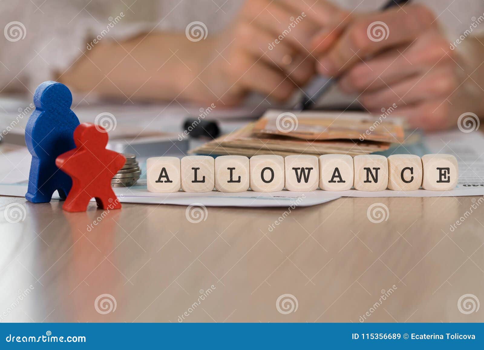 Word ALLOWANCE composed of wooden letters. Closeup