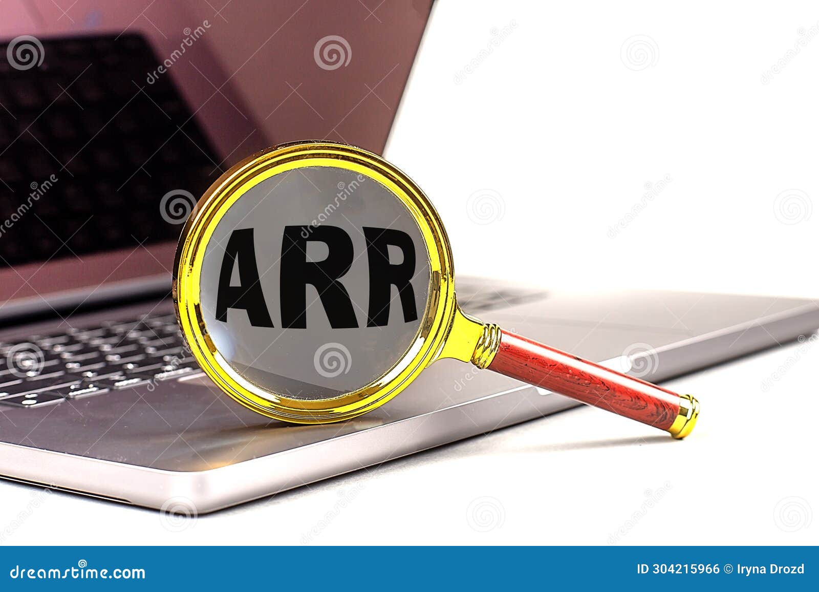 word arr on magnifier on laptop , business concept