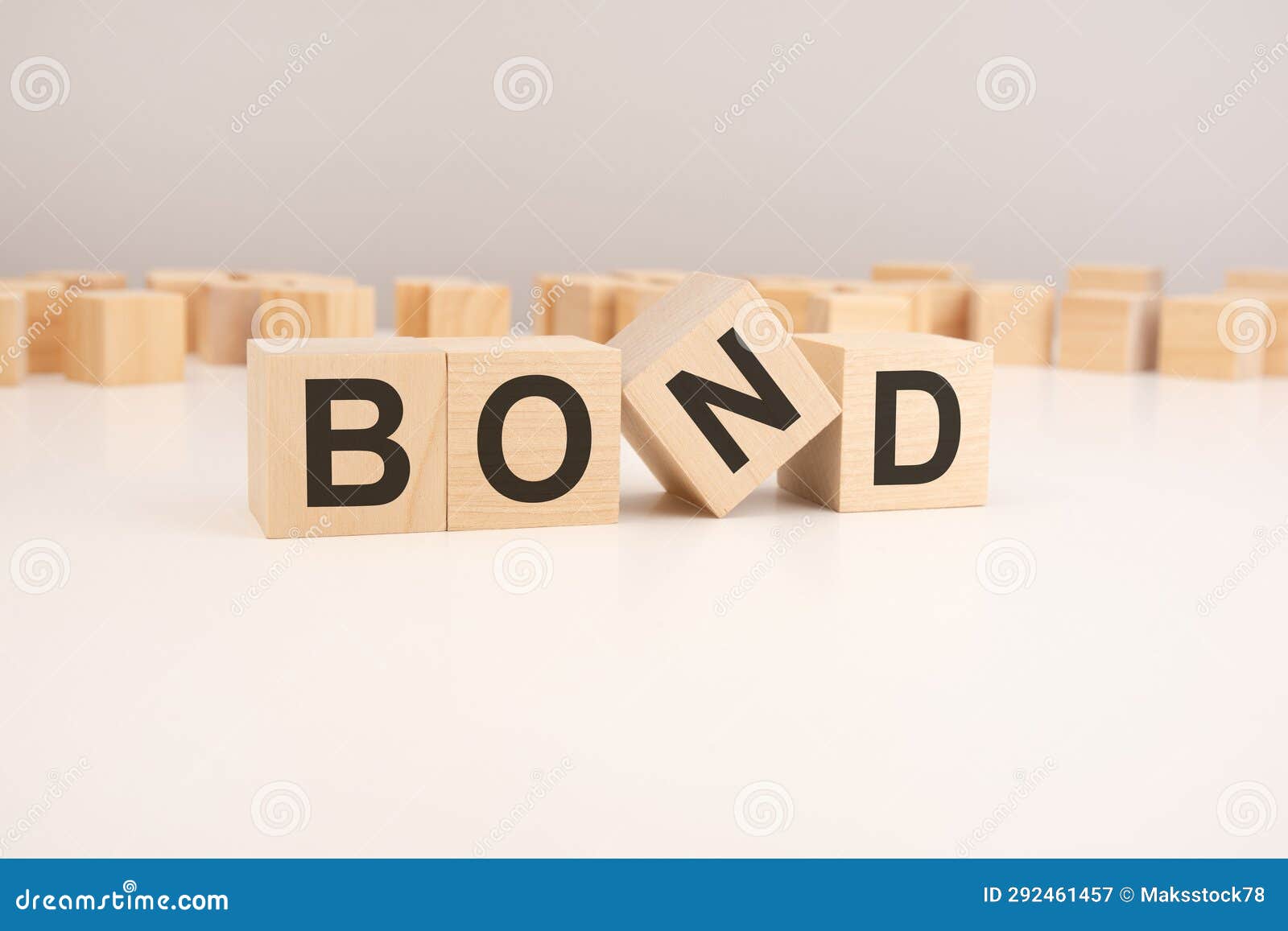 The Word Bond Written on Wooden Dice Lying on a Table Stock Image Image of debt, bonds 292461457