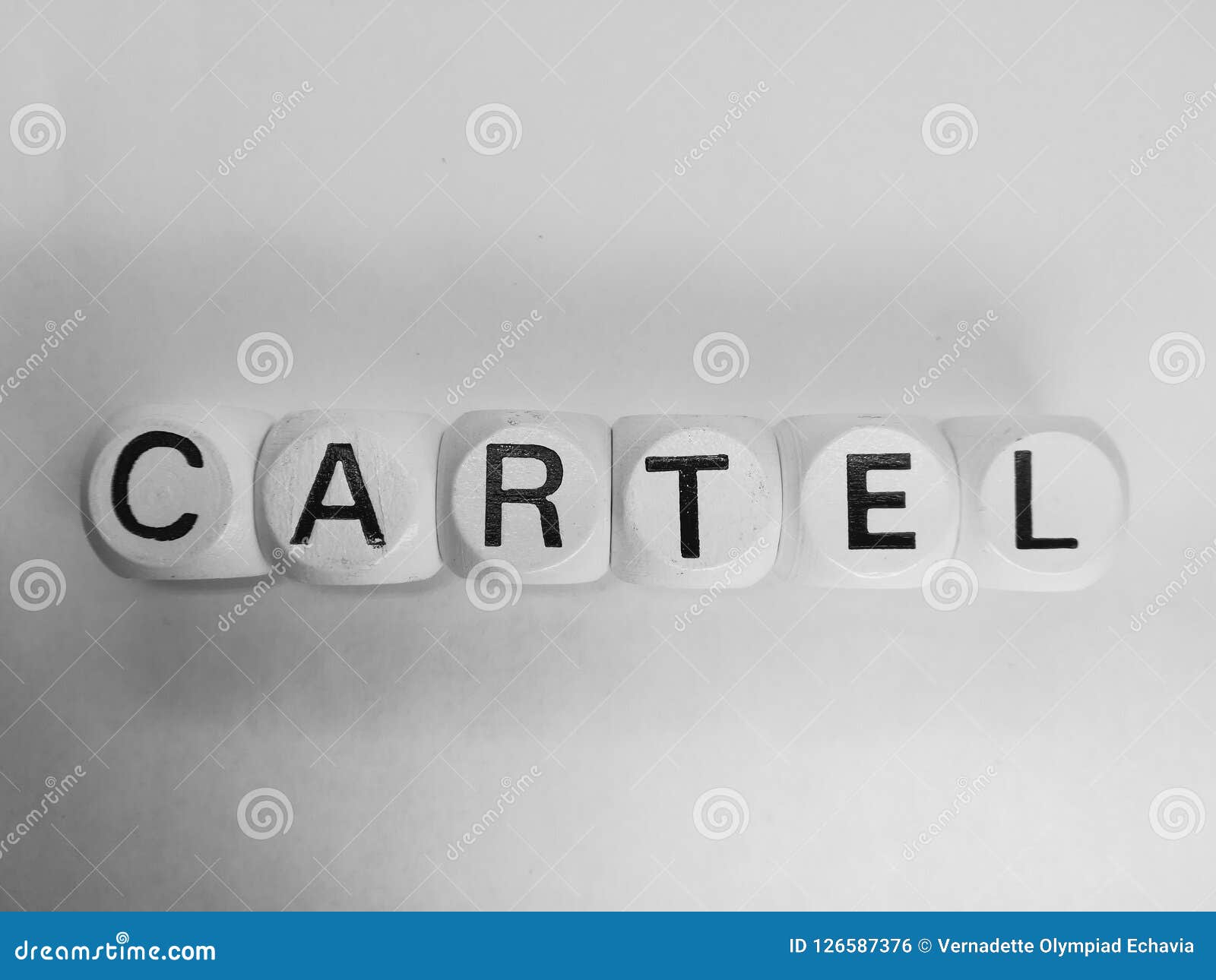 word cartel spelled on dice