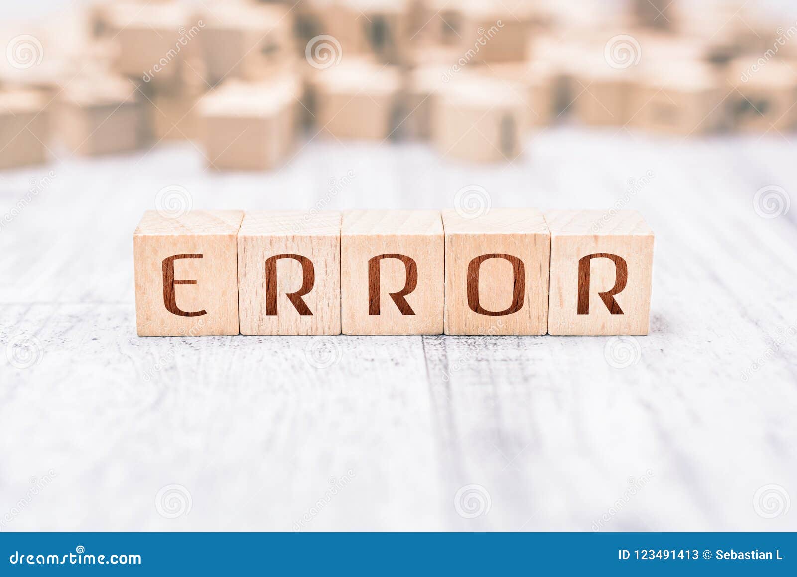 The Word Error Formed by Wooden Blocks on a White Table Stock Image