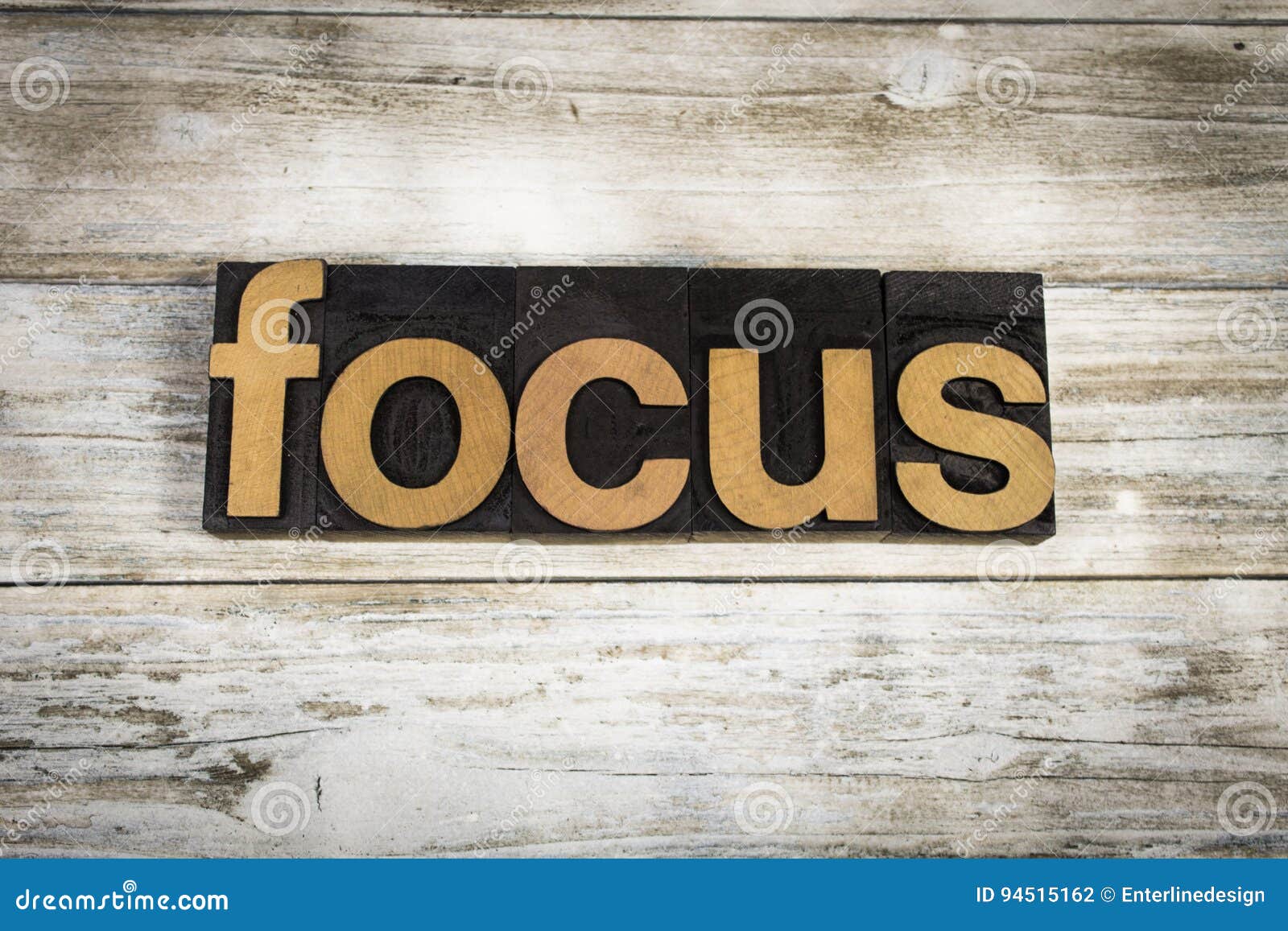 focus letterpress word on wooden background