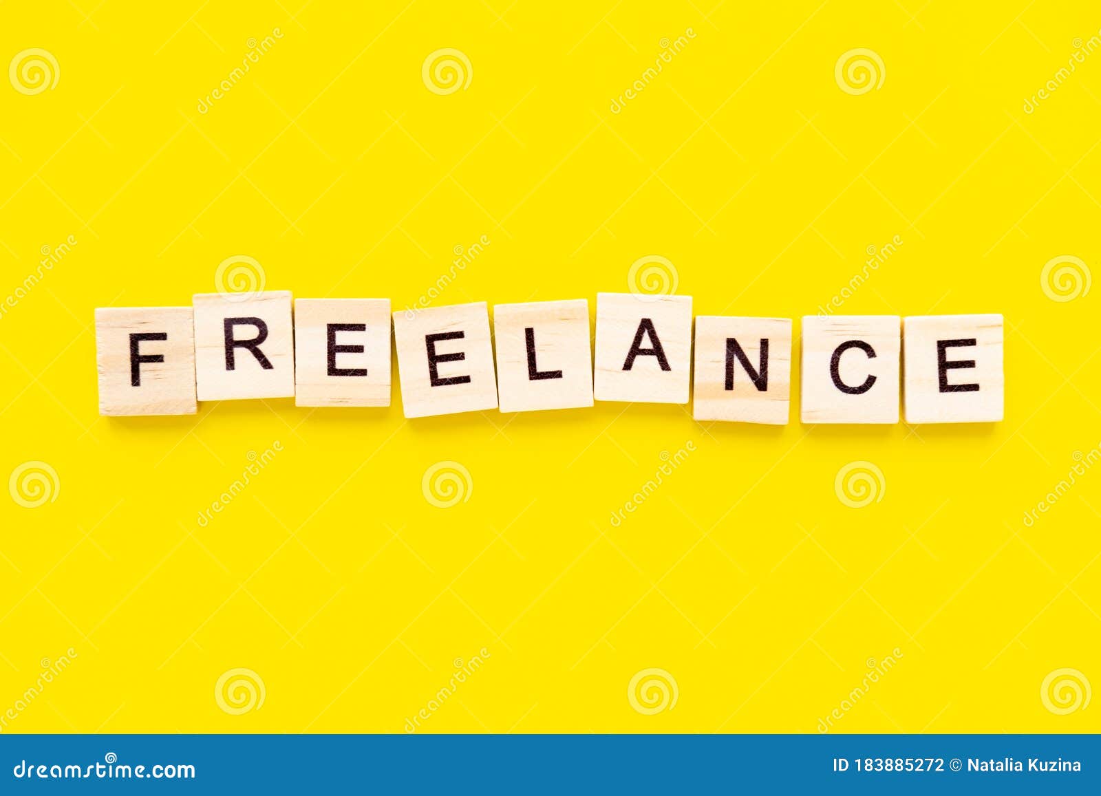 word freelance. wooden blocks with lettering on top of yellow background. human resource management and recruitment and