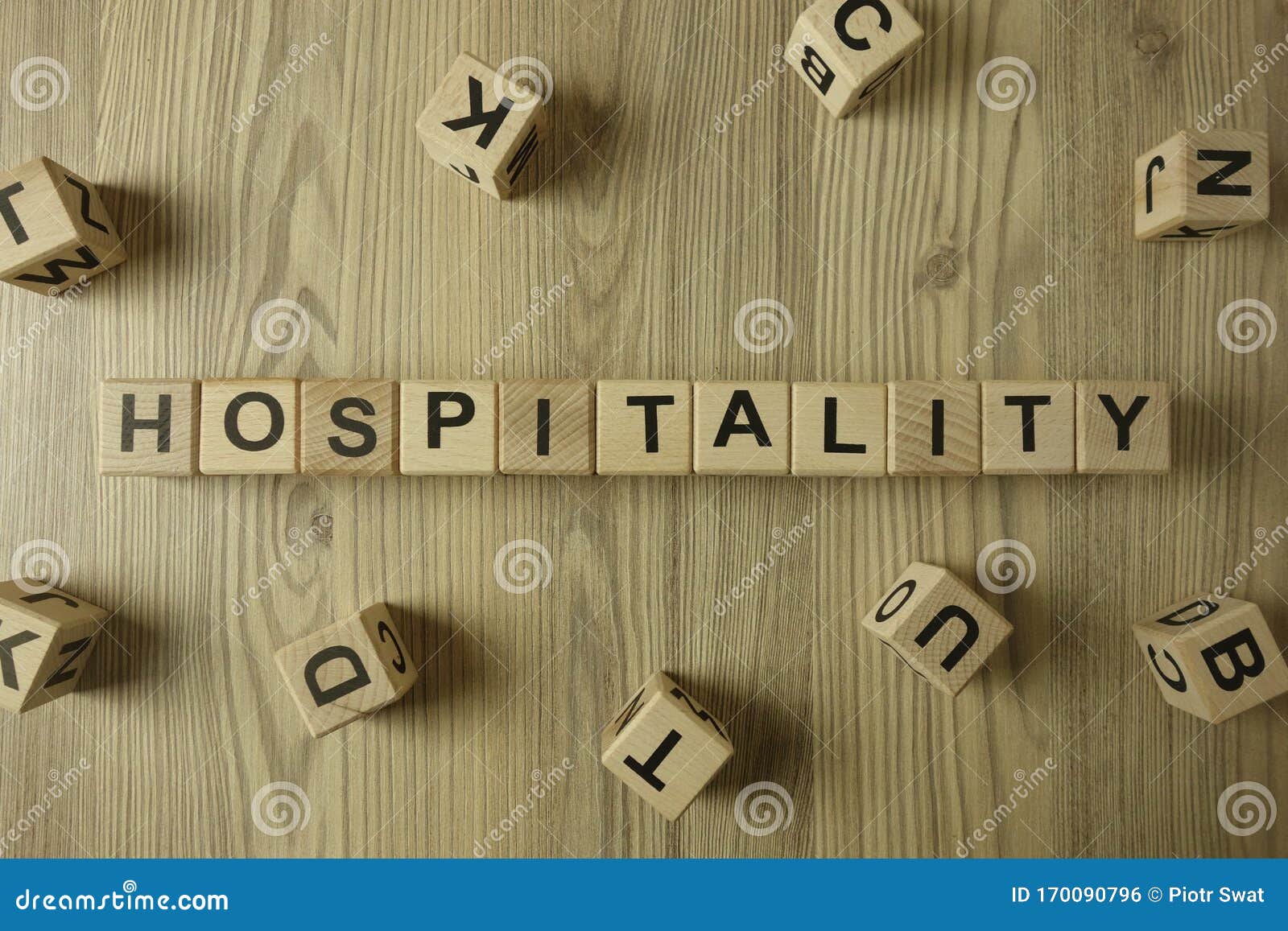 word hospitality from wooden blocks on desk