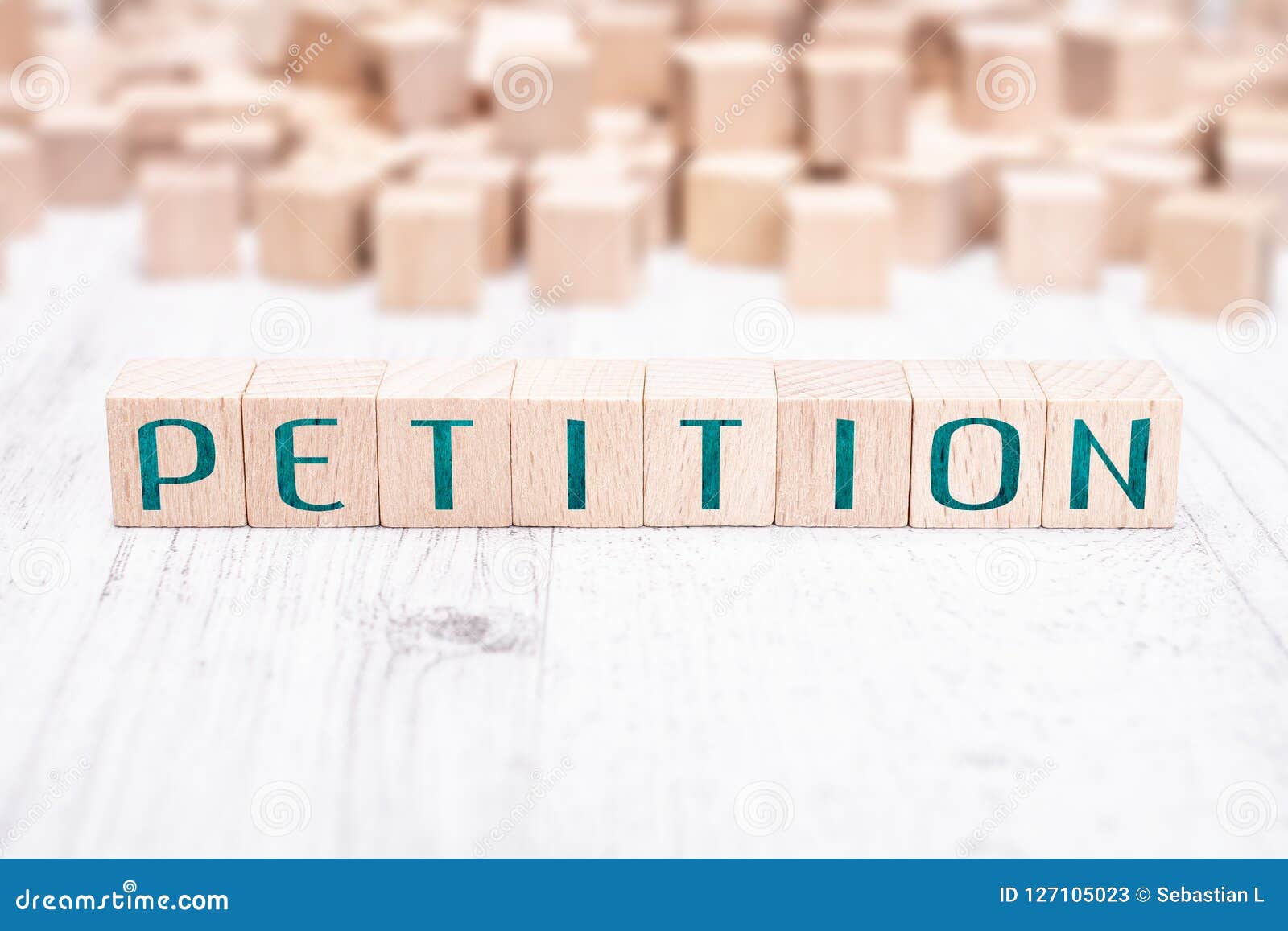 The Word Petition Formed by Wooden Blocks on a White Table Stock Image