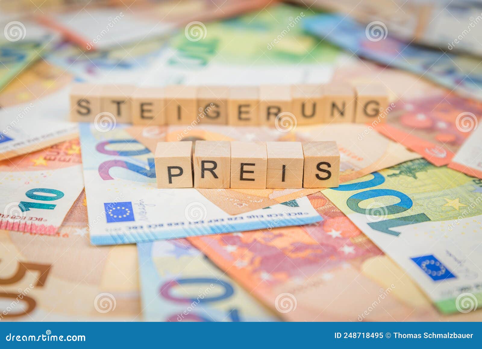 the word preis - in german for price - and steigerung - in german for increase - in the background on banknotes euro notes written