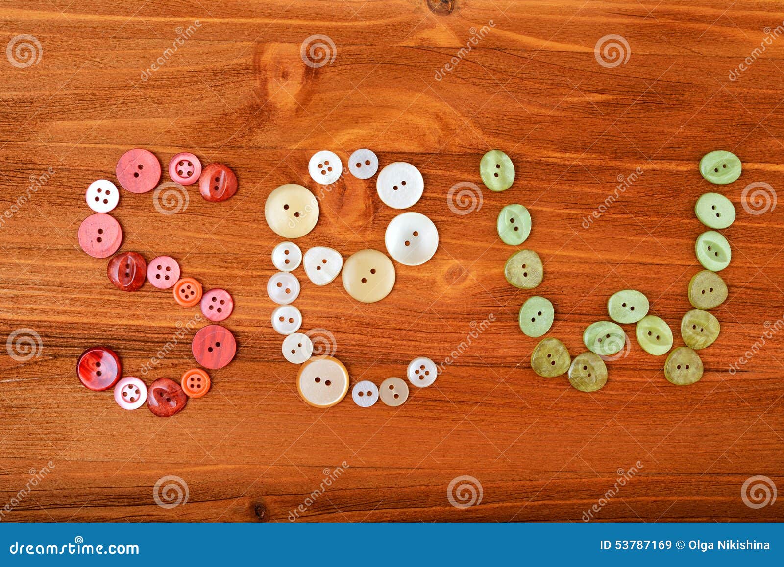 Word Sew from Multicolored Sewing Buttons on Wooden Background Stock