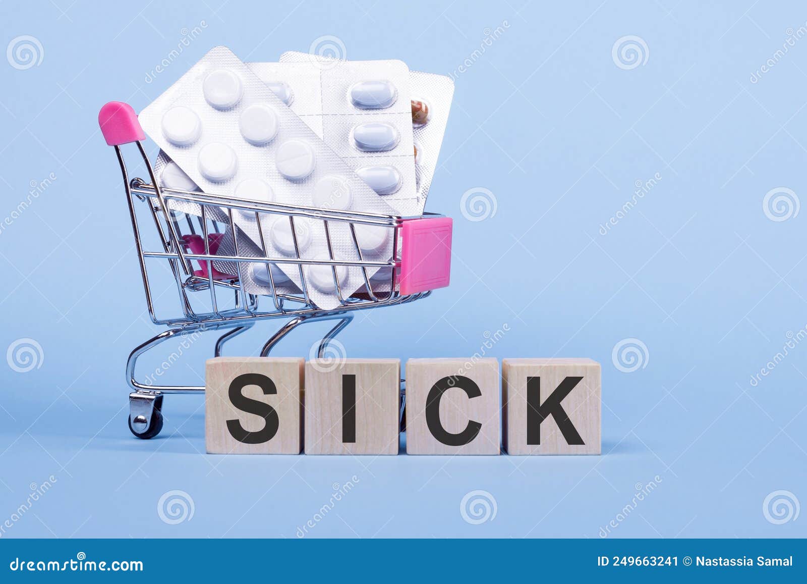 The Word SICK Written Wooden Blocks On A Blue Background Stock Image the-word-sick-written-wooden-blocks-on-a-blue-background-stock-image