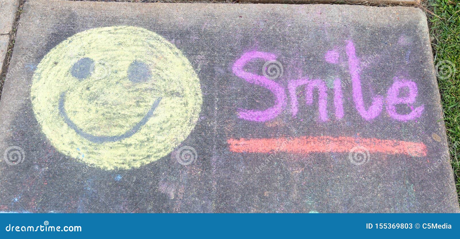 the word smile" and smiley face emoji sidewalk chalk