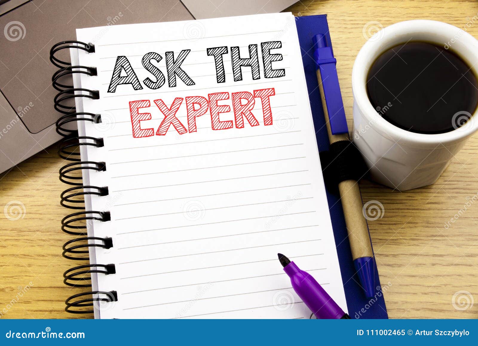 word, writing ask the expert. business concept for advice help question written on notebook book on the wooden background in the o