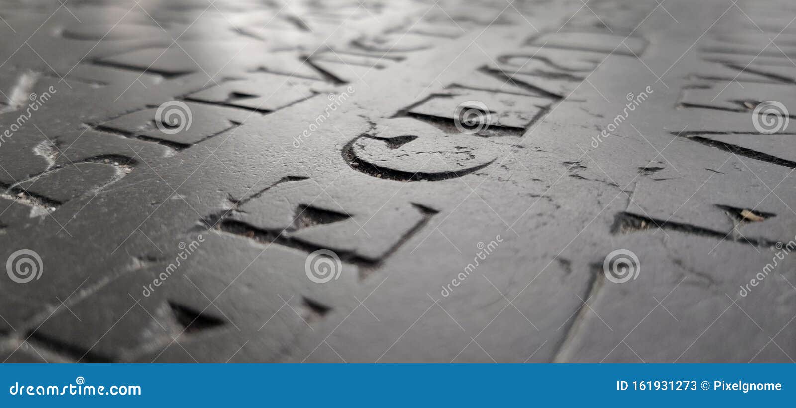 words etched in stone with dramatic light.