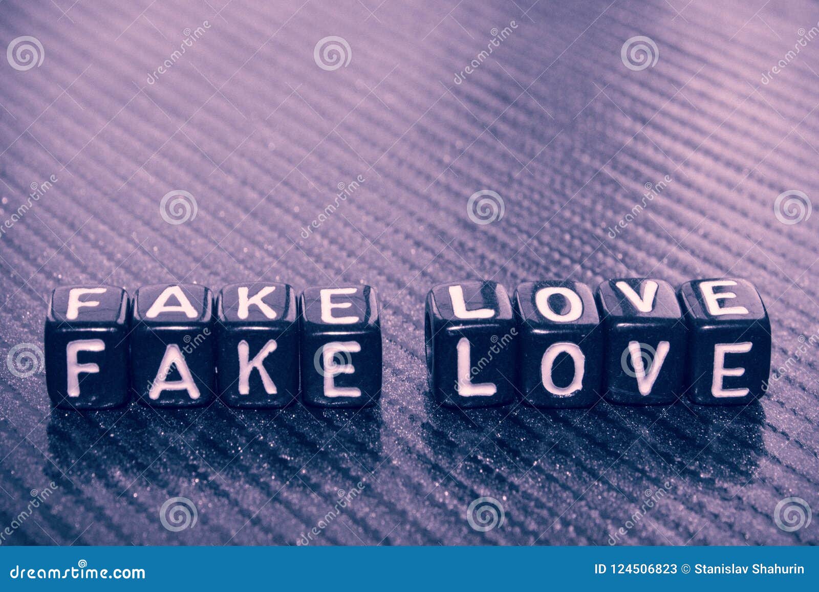 The Words Fake Love of Black Cubes on Dark Stock Image - Image of ...