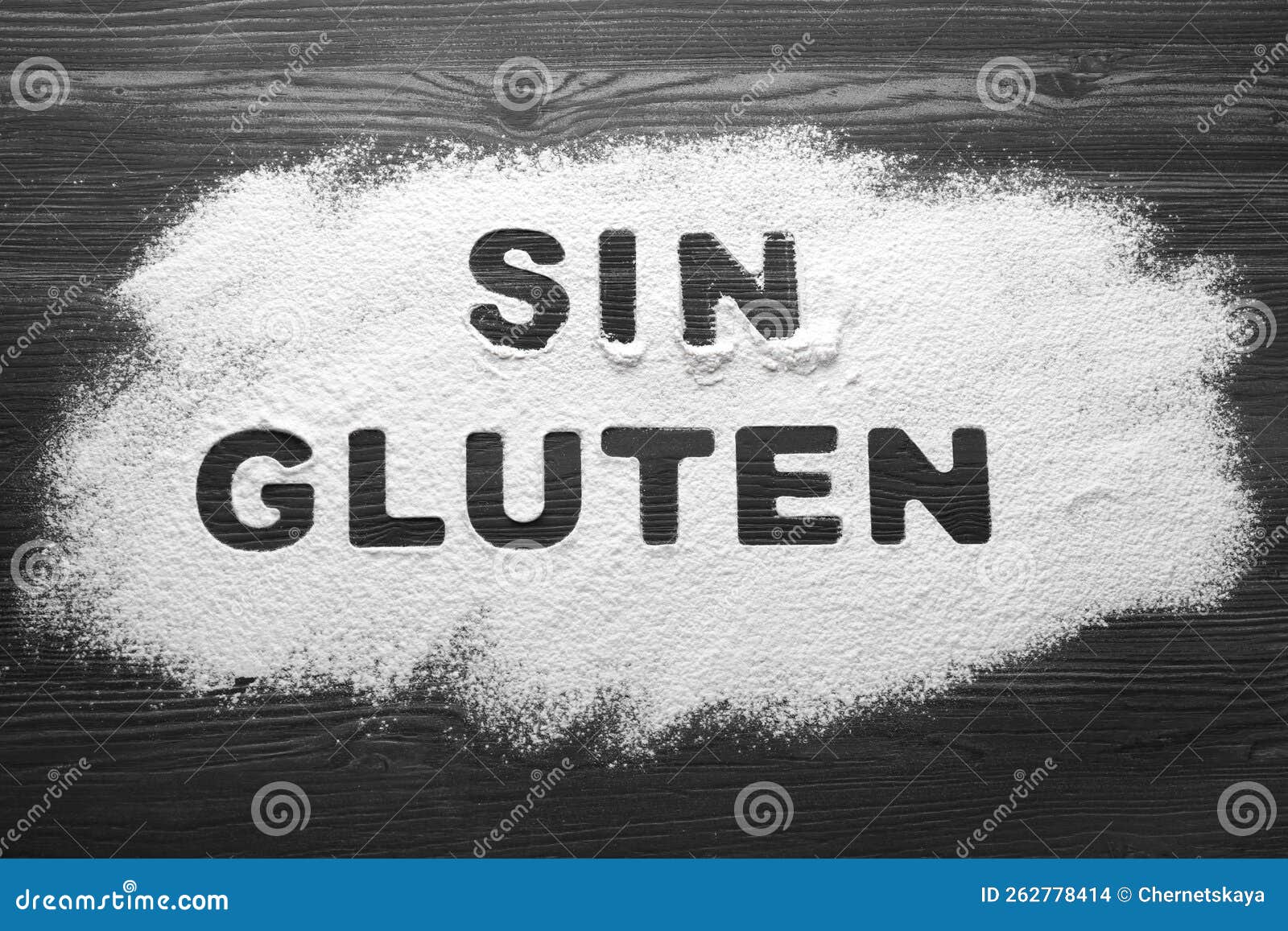 words sin gluten written with flour on dark wooden table, top view