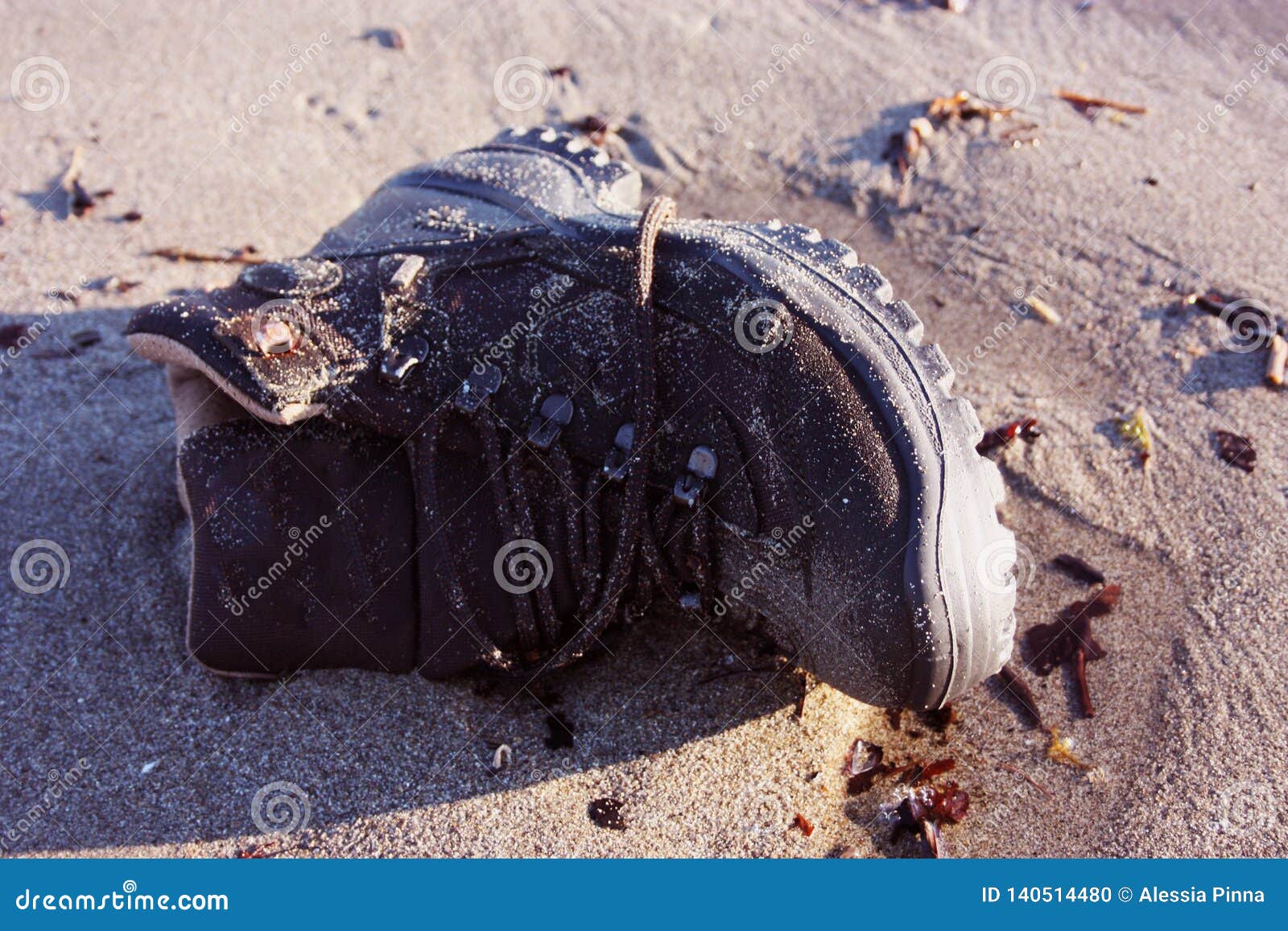 Work Boot. Object of Clothing Abandoned among the Dirt on a Sandy Beach ...