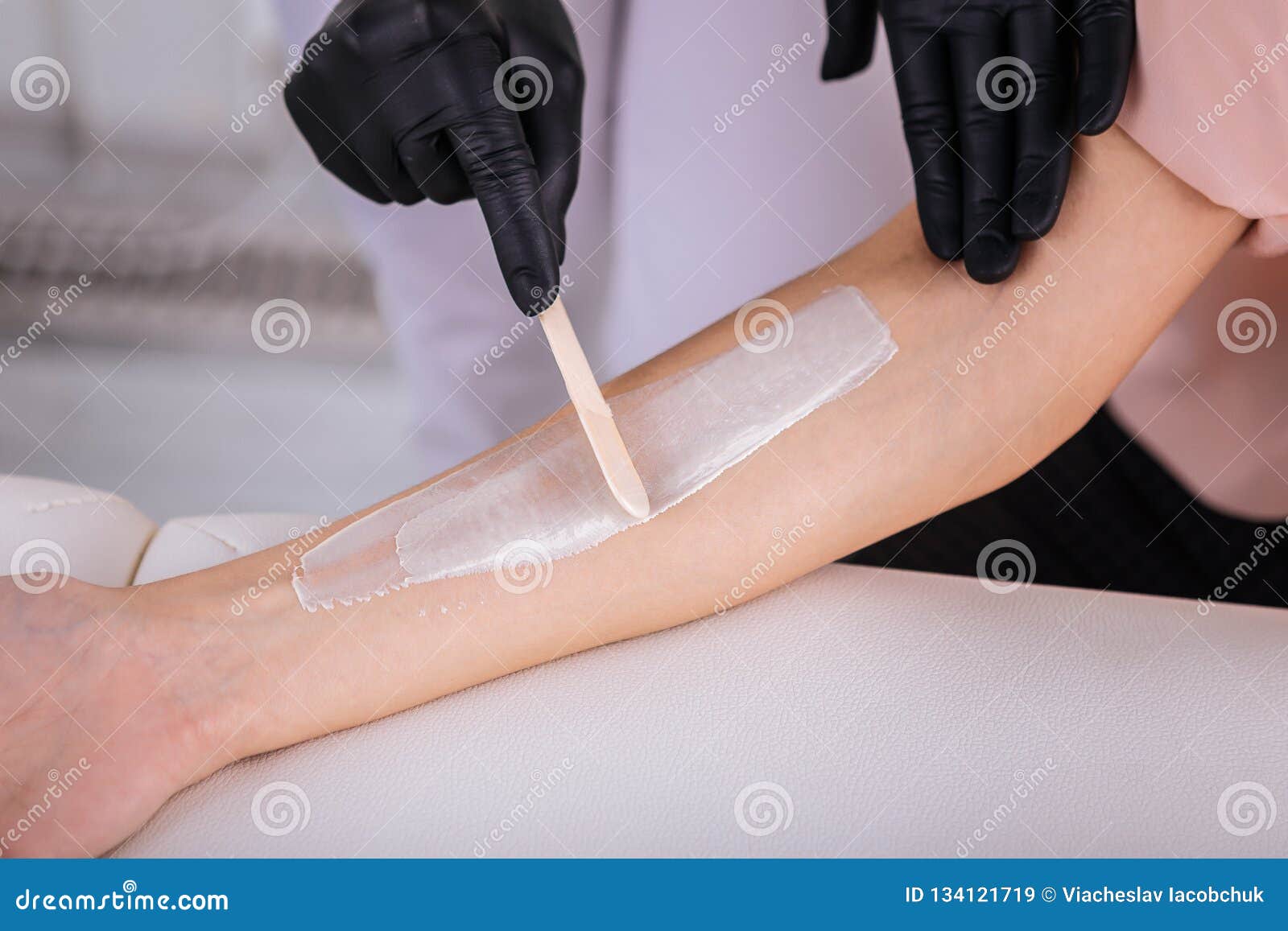 Top View of Depilatory Master Working Hard with Her Client Stock Image