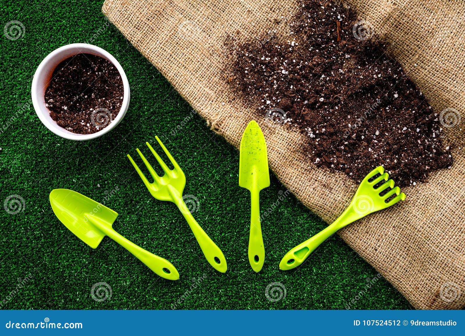 Work in Garden. Tools Near Soil on Canvas and Green Grass Background ...