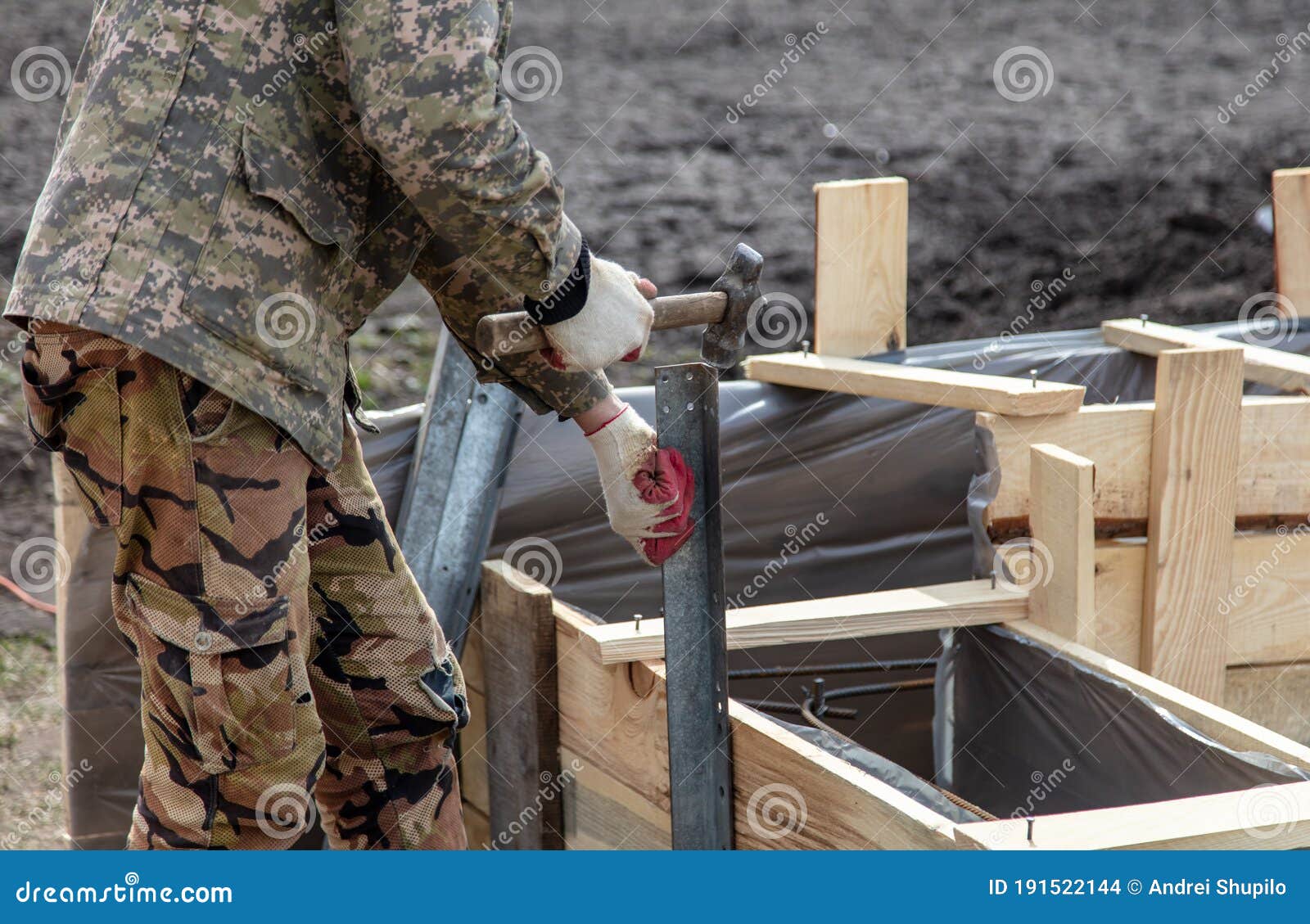 Work Hammer Hammers Metal at a Construction Site at Home Stock Photo