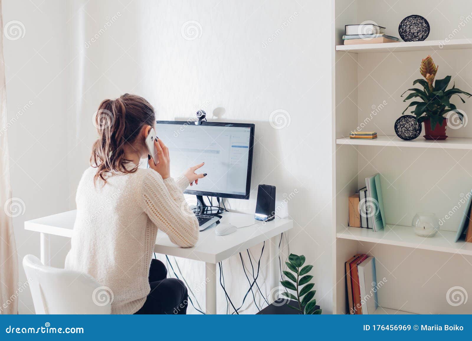 work from home during coromavirus pandemic. woman stays home. workspace of freelancer. office interior with computer
