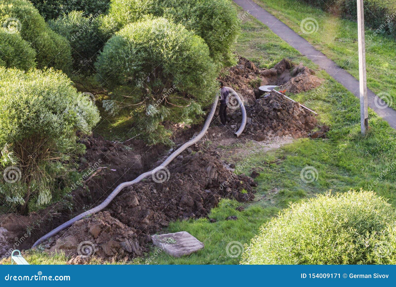 Worker Lays the Pipe in the Trench Editorial Photo Image of