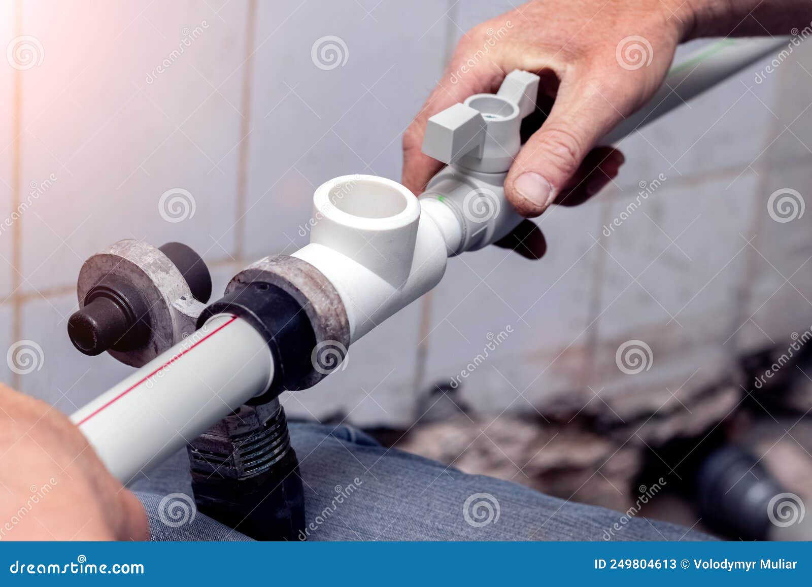Work on the Installation of Heating or Plumbing. the Master Connects Plastic Pipes with a