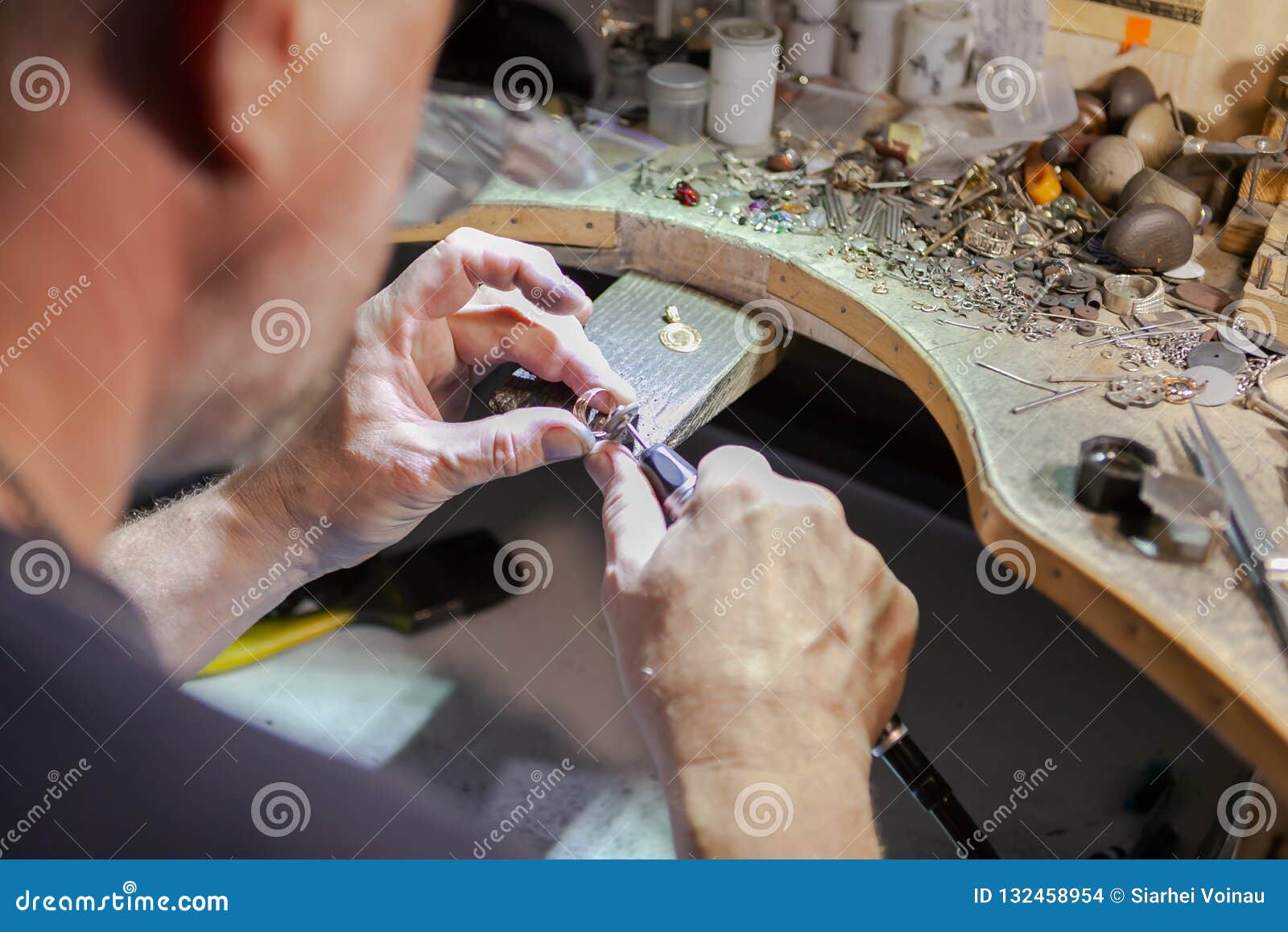 work of the master, jeweler. jewelry repair shop. manufacturing of jewelry