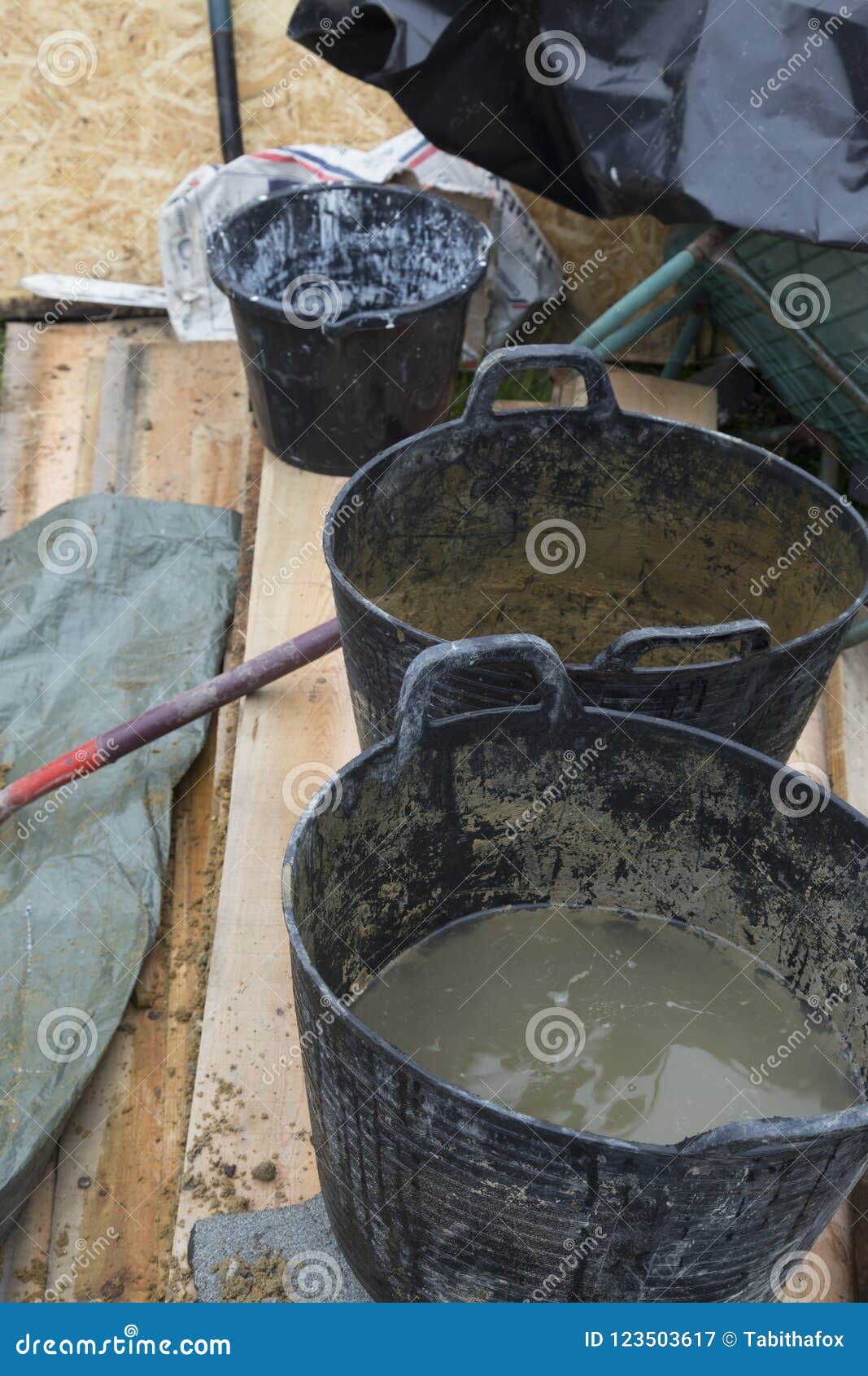 Buckets of wet cement stock image. Image of work, artist 123503617