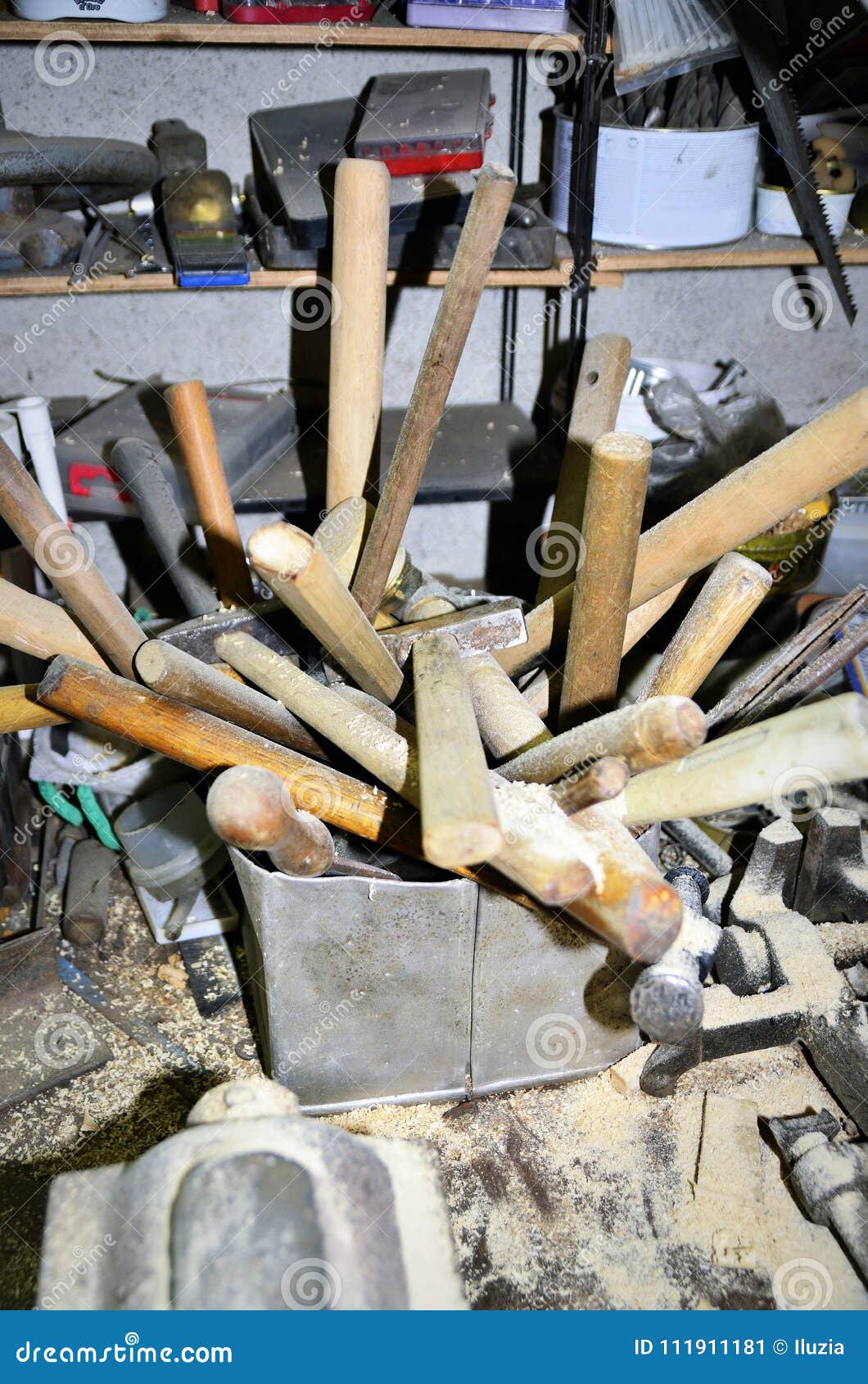 work table of a carpenter with many tools olds hanging
