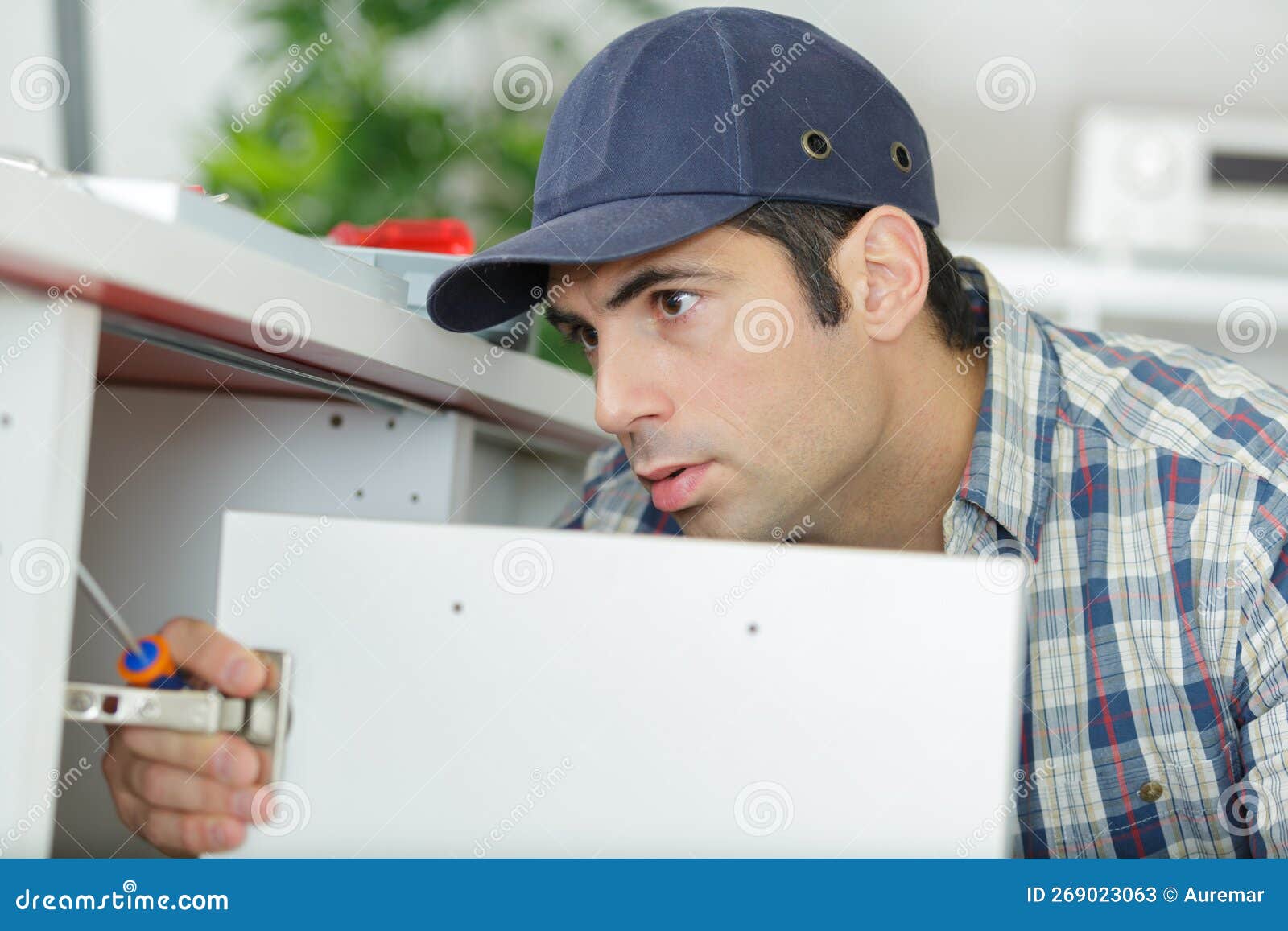 Worker Assembles Furniture in Kitchen Stock Image Image of kitchen