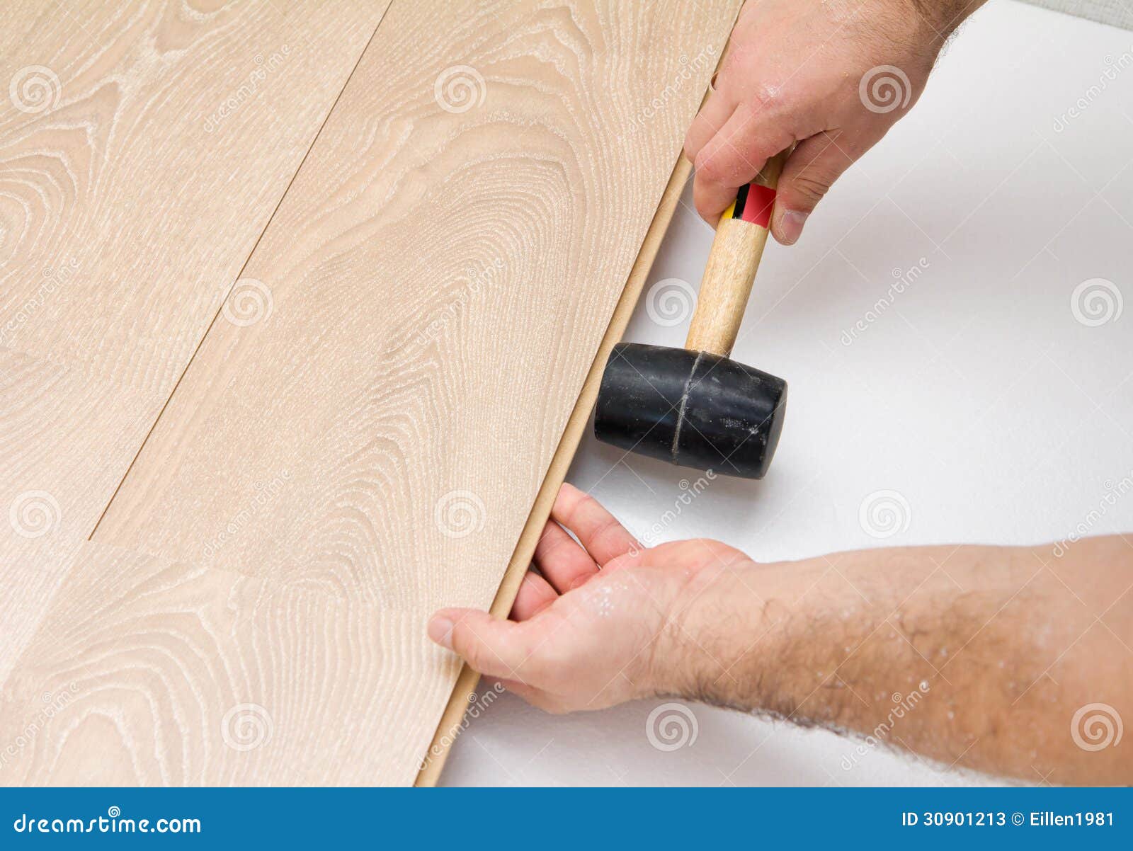 Worker Assembling Laminate Floor Using a Hammer Stock Image Image of