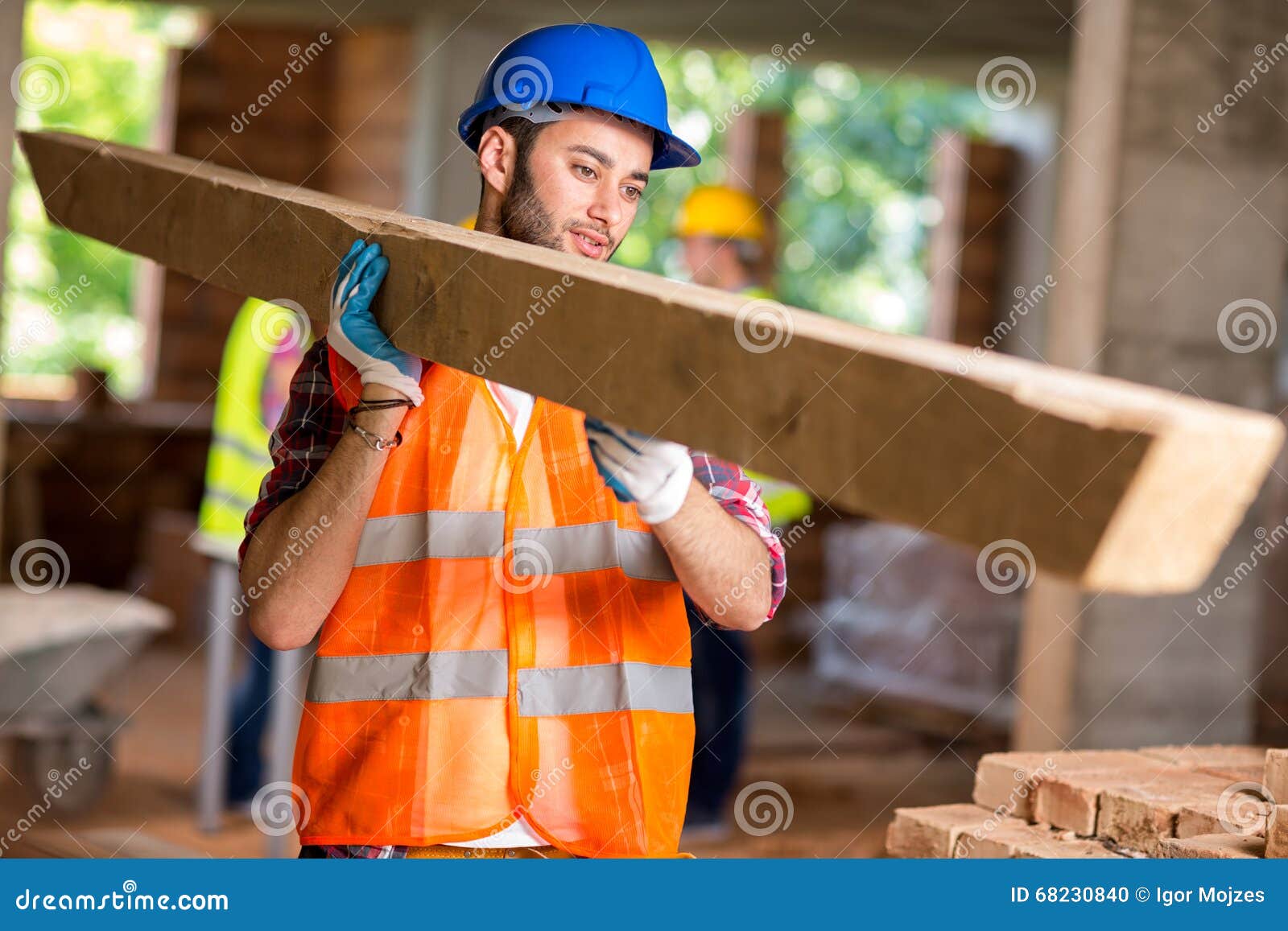 worker bring construction timber