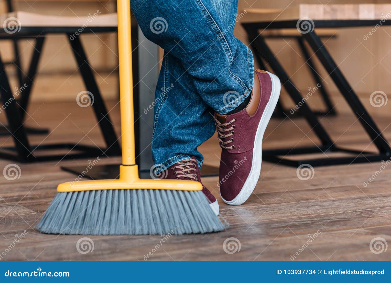Worker with broom in cafe stock photo. Image of object 103937734
