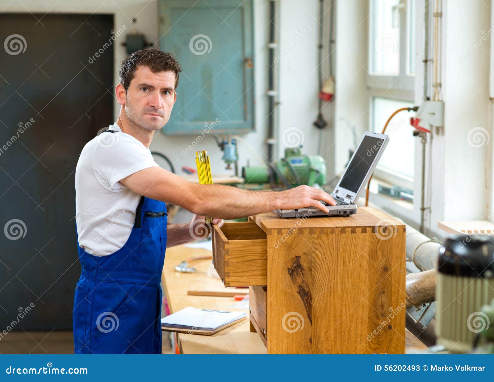 Worker In A Carpenter S Workshop With Computer Stock Image Image