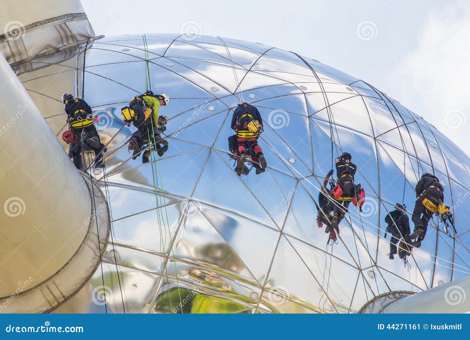 Worker cleaning high tower editorial photo. Image of installation