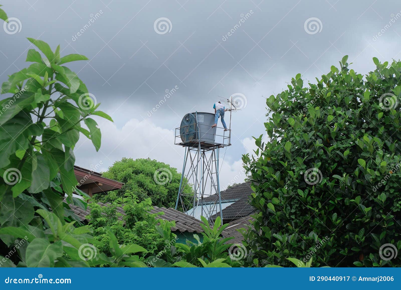 Worker Cleaning in Water Tank on the Tower. Water Storage Stock Image