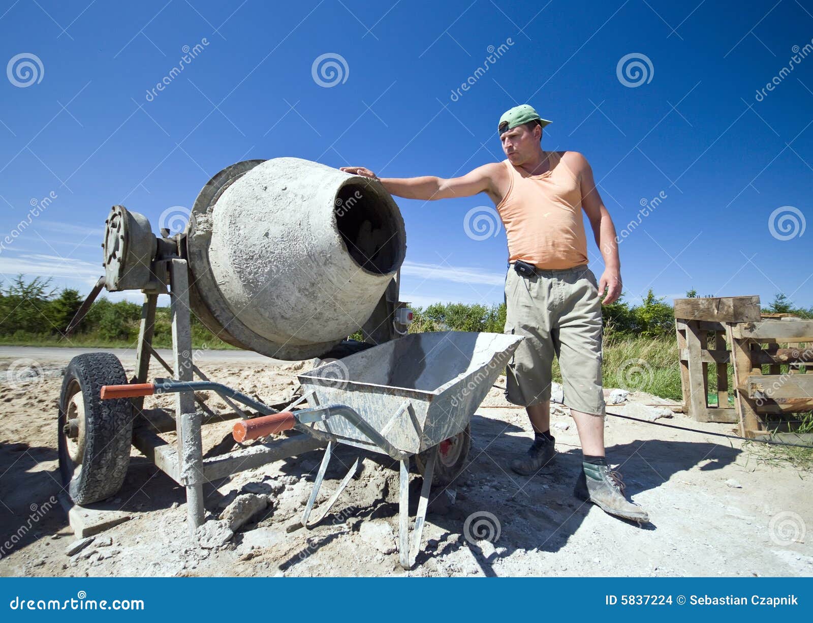 Worker and concrete mixer stock photo. Image of worker - 5837224