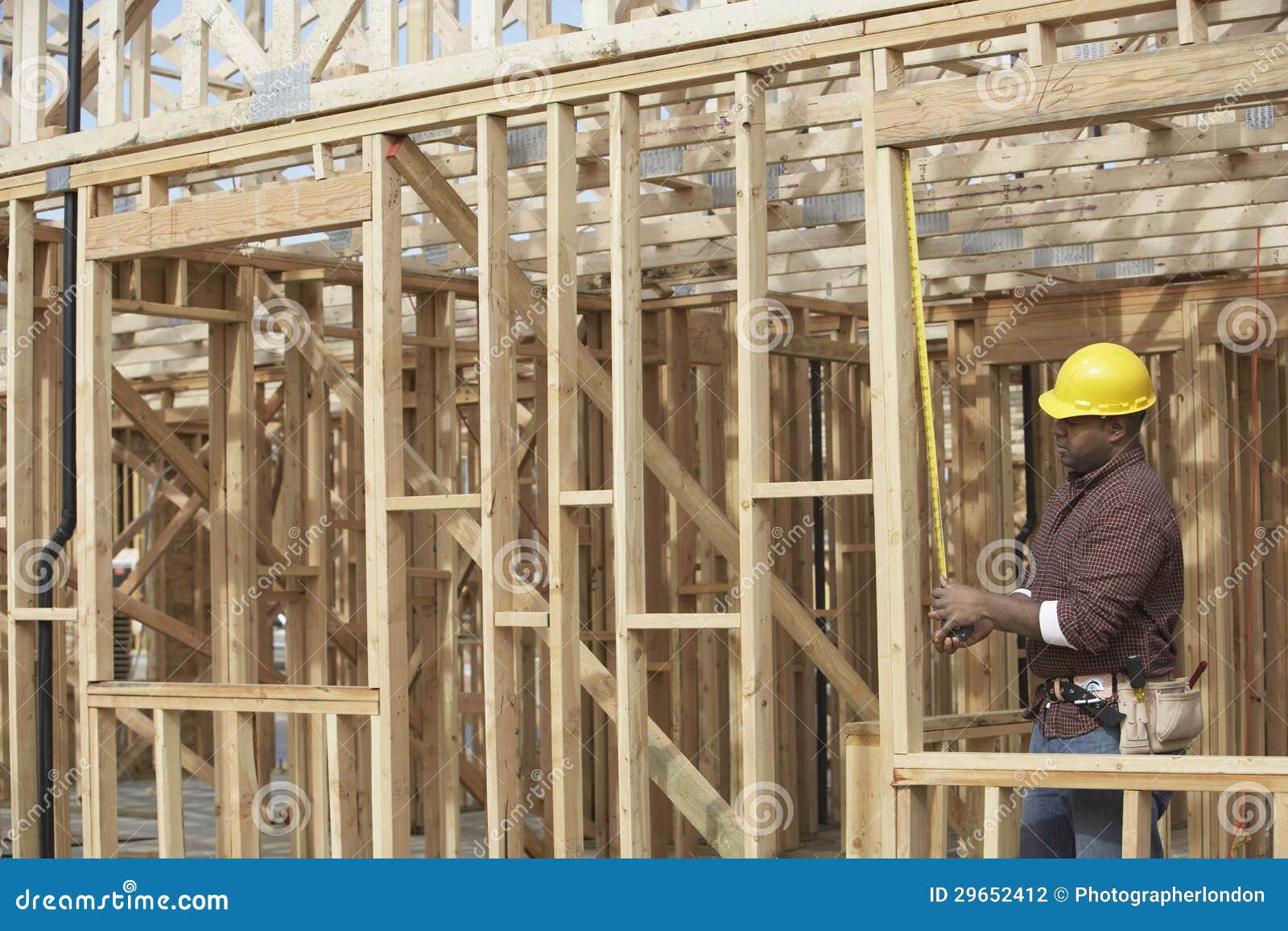 worker at construction site checking formwork