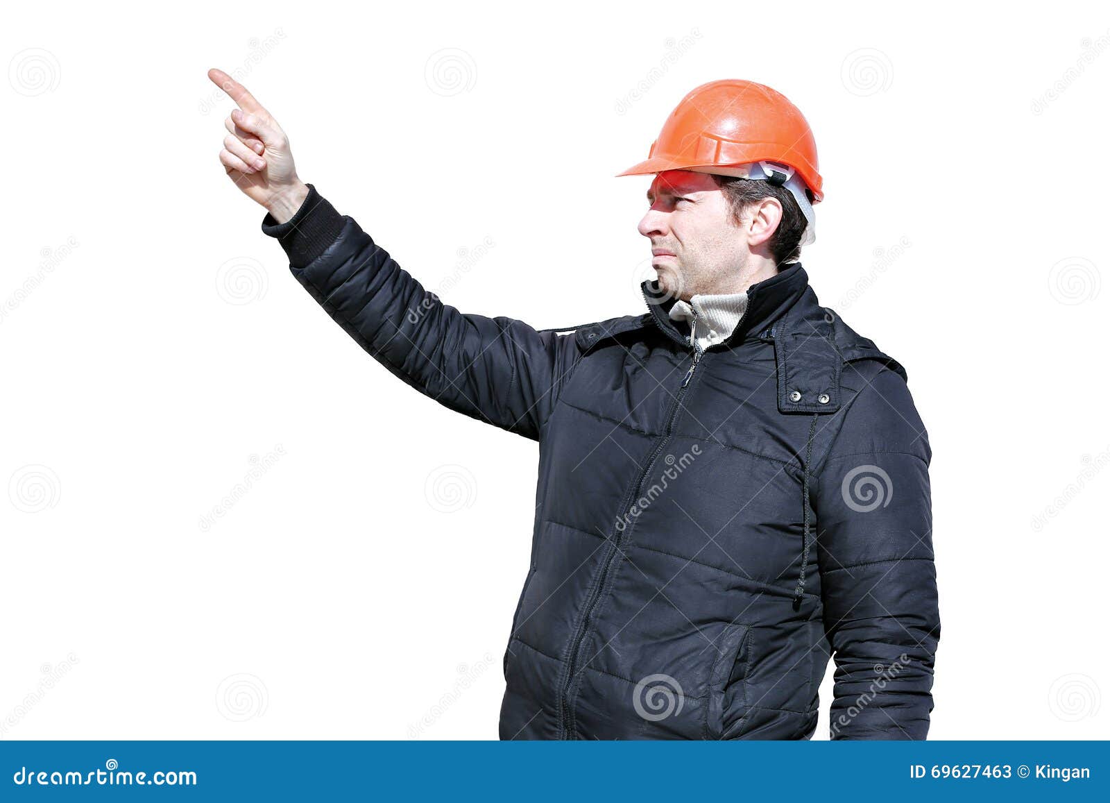 worker on a construction site in winter directs and hand gesticulating