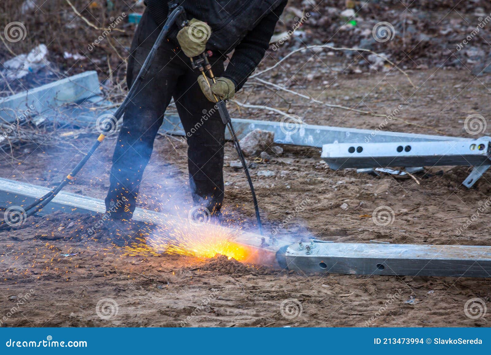 A Worker Cut Steel Beams Using Propane-oxygen Torch. Stock Photo