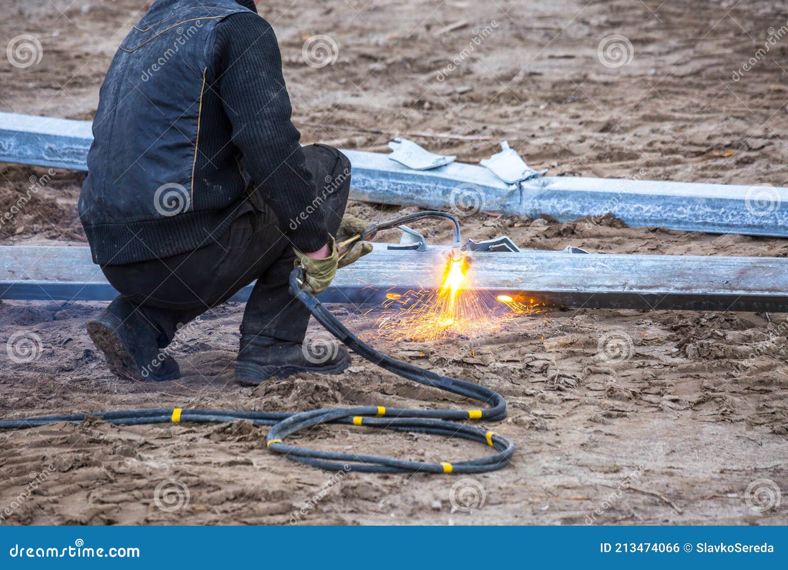 A Worker Cut Steel Beams Using Propane-oxygen Torch. Stock Photo
