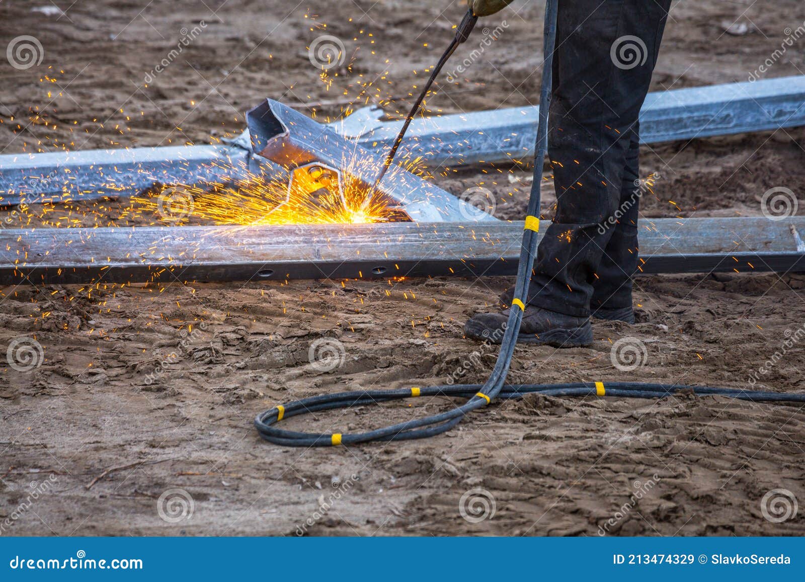 A Worker Cut Steel Beams Using Propane-oxygen Torch. Stock Image