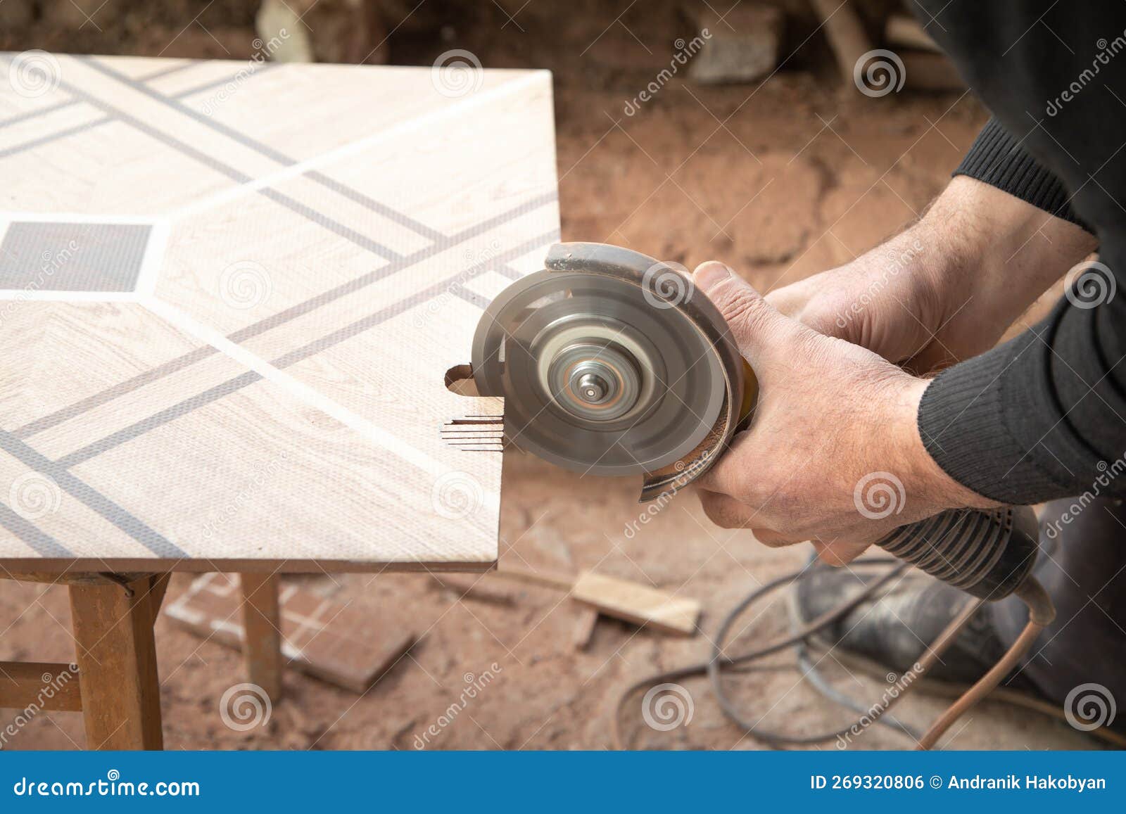 Worker Cutting a Ceramic Tile with a Grinder Stock Photo Image of